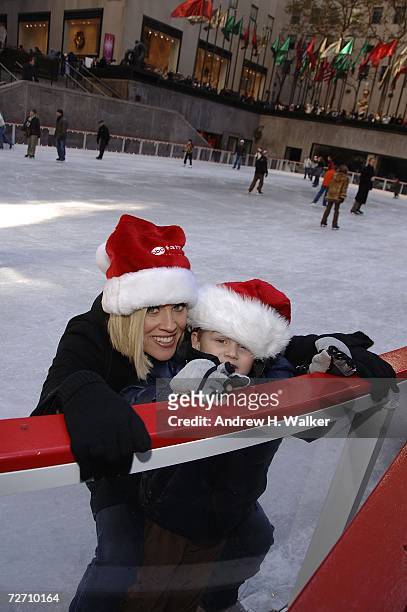S Santa Baby's Jenny McCarthy helps her son Evan Asher ice skate at the Rockefeller Center Ice Rink during the ABC Family 25 Days Of Christmas Winter...
