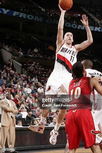 Sergio Rodriguez of the Portland Trail Blazers takes a shot over Tyronn Lue of the Atlanta Hawks during a game on December 3, 2006 at the Rose Garden...