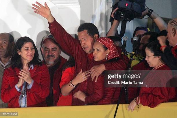 President Hugo Chavez waves to the crowd after delivering his victory speech at Miraflores Palace following the presidential elections December 3,...