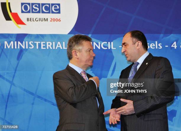 Belgium's Minister of Foreign Affairs Karel De Gucht chats with hist Azeri counterpart Elmar Mammadyarov 04 December 2006 during the working session...