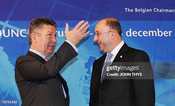 Belgium's Minister of Foreign Affairs Karel De Gucht chats with hist Georgian counterpart Gela Bejuashvili 04 December 2006 during the first working...