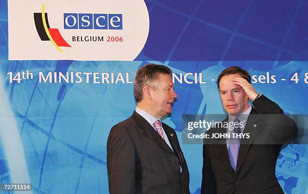 Belgium's Minister of Foreign Affairs Karel De Gucht chats with his US counterpart Nicolas Burns 04 December 2006 during the working session of the...