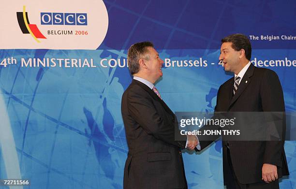 Belgium's Minister of Foreign Affairs Karel De Gucht greets his Armenian counterpart Vartan Oskanian prior a working session of the Organization for...