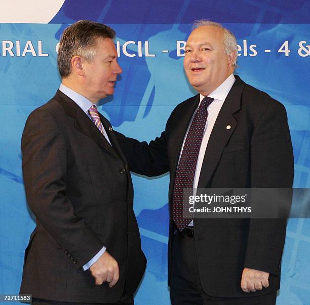 Belgium's Minister of Foreign Affairs Karel De Gucht greets his Spanish counterpart Spanish counterpart Miguel Angel Moratinos prior a working...