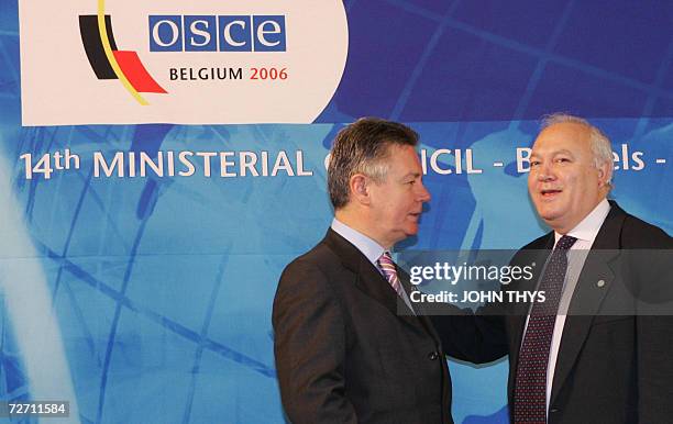 Belgium's Minister of Foreign Affairs Karel De Gucht greets his Spanish counterpart Miguel Angel Moratinos prior a working session of the...