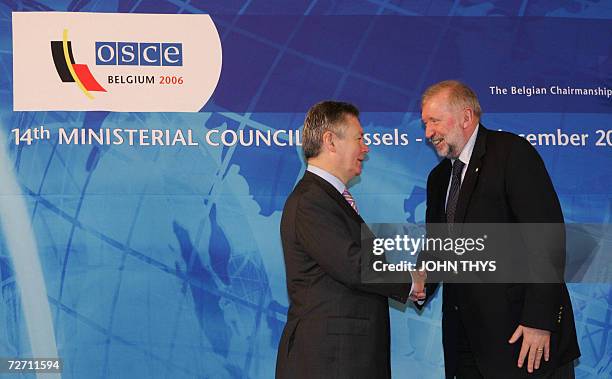 Belgium's Minister of Foreign Affairs Karel De Gucht greets his Slovenian counterpartDimitrij Rupel prior a working session of the Organization for...