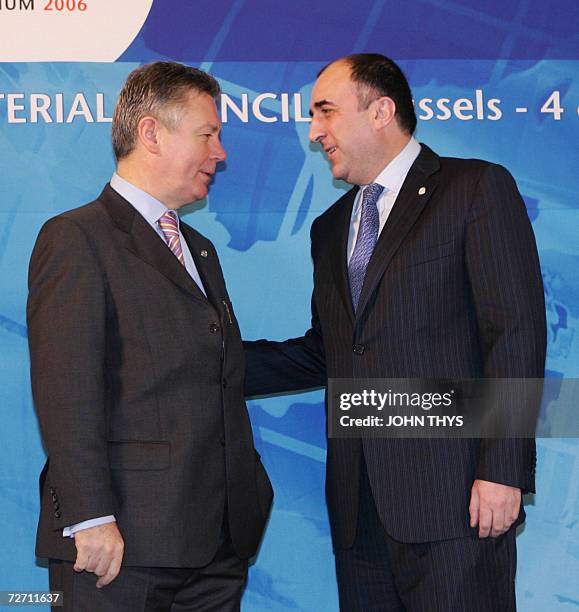 Belgium's Minister of Foreign Affairs Karel De Gucht greets his Azeri counterpart Elmar Mammadyarov prior a working session of the Organization for...