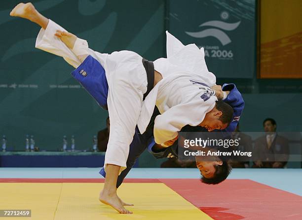 Lee Won Hee of the Republic of Korea throws Khalifa Al-Qubaisi of the United Arab Emirates during the Men's Judo 73kg preliminary round during the...