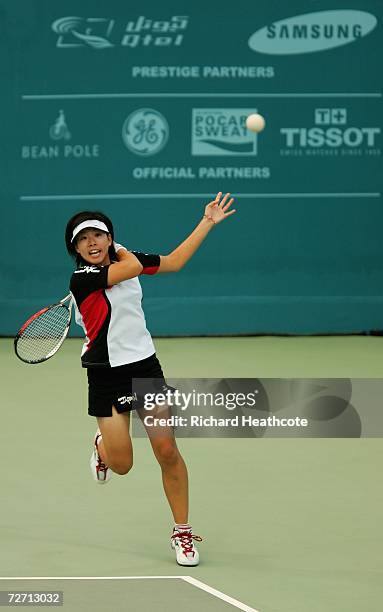 Harumi Gyokusen of Japan returns the ball during her match with Tsuneo Takagawa against Ji Eun Kim and Hyu Hwan We of Korea in the Mixed Doubles Soft...