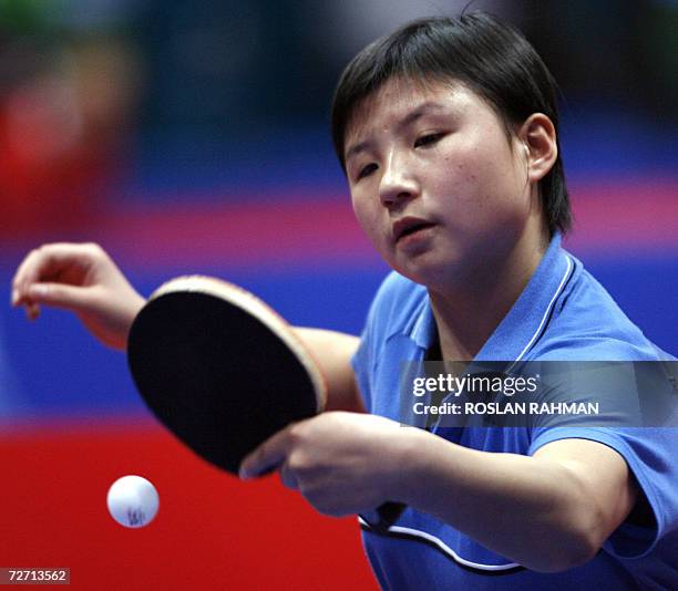 South Korea's Kim Jong competes against Vietnam's Luong Thi Tham during the Women's Single of the round 32 match at the Al-Arabi Sports Club during...