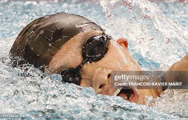 China's Yang Jieqiao powers through the water on to victory in the women's 400m freestyle swimming final at the Hamad Aquatic Centre during the 15th...