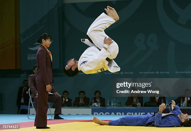Tsagaanbaatar Haskhbaatar of Mongolia celebrates with a somersault after winning the gold medal, by defeating Arash Miresmaeili of the Islamic...
