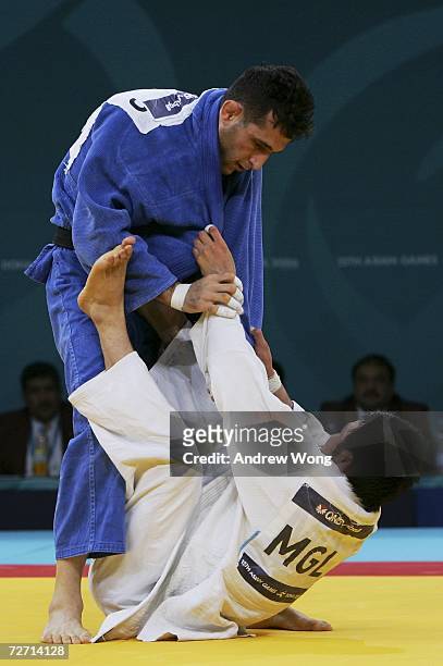 Tsagaanbaatar Haskhbaatar of Mongolia tussles with Arash Miresmaeili of the Islamic Republic of Iran during the Men's Judo 66kg final during the 15th...