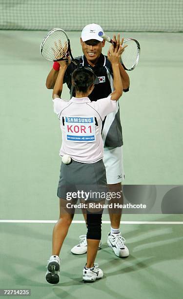 Hyu Hwan We and Ji Eun Kim of Korea celebrate after victory over Kim Kyung Ryun and You Young Dong of Korea in the Mixed Doubles Soft Tennis Final...