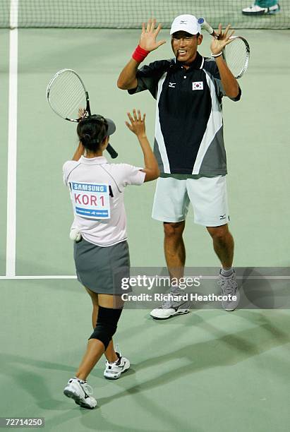 Hyu Hwan We and Ji Eun Kim of Korea celebrate after victory over Kim Kyung Ryun and You Young Dong of Korea in the Mixed Doubles Soft Tennis Final...