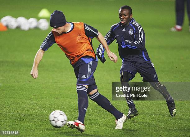 Shaun Wright-Phillips chases Wayne Bridge of Chelsea during training before their UEFA Champions League match against Levski Sofia at Stamford Bridge...
