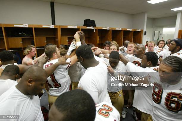 The San Francisco 49ers come together in the locker room after the game against the St. Louis Rams at Edward Jones Dome on November 26, 2006 in St....