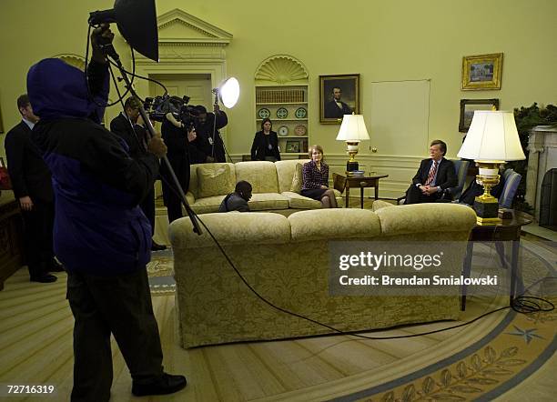 Ambassador to the UN John Bolton sits in the Oval Office of the White House with his wife Gretchen Bolton after a meeting with US President George W....