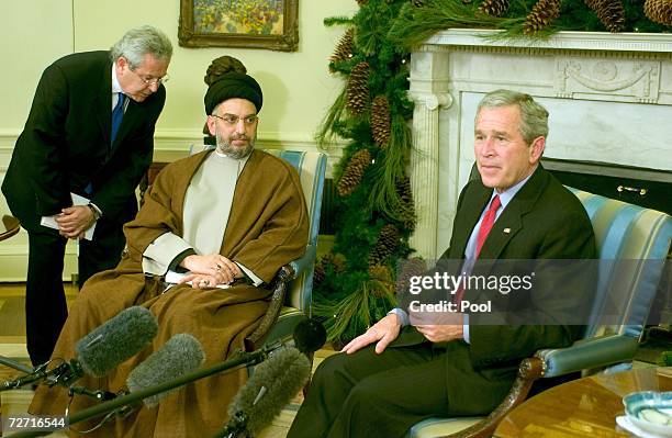 Iraqi Shiite Leader Abdul-Aziz al-Hakim meets with US President George W. Bush in the Oval Office of the White House December 4, 2006 in Washington,...
