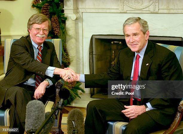 President George W. Bush and Ambassador to the UN John Bolton meet in the Oval Office of the White House December 4, 2006 in Washington, DC. Bush...