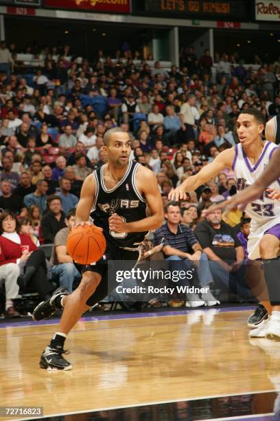 Tony Parker of the San Antonio Spurs drives past Kevin Martin of the Sacramento Kings during the game at Arco Arena on November 19, 2006 in...