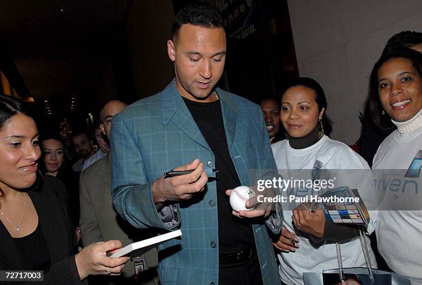 Baseball Player Derek Jeter autographs memorabilia for a team of Avon Representatives who attended a television appearance for the launch of his new...