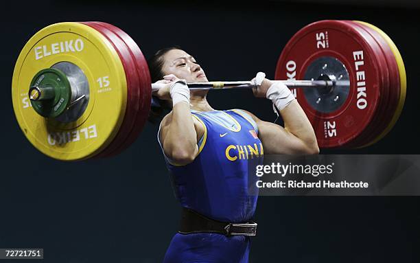 Cao Lei of China competes in the Women's 75kg Weightlifting Group A Final during the 15th Asian Games Doha 2006 at the Al-Dana Banquet Hall on...