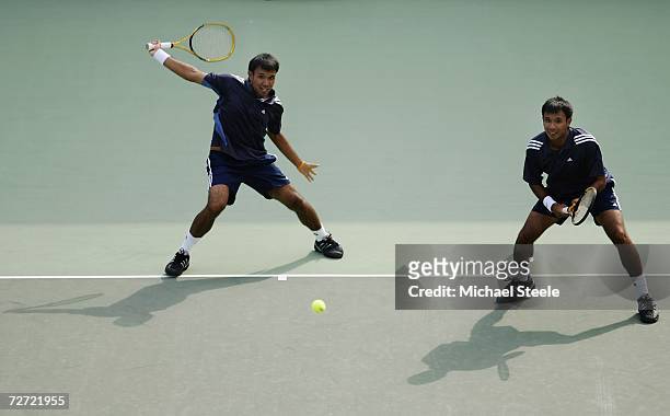 Sonchat and Sanchai Ratiwatana of Thailand in action while playing against Denis Istomin and Murad Inoyatov of Uzbekistan during the Men's Team...