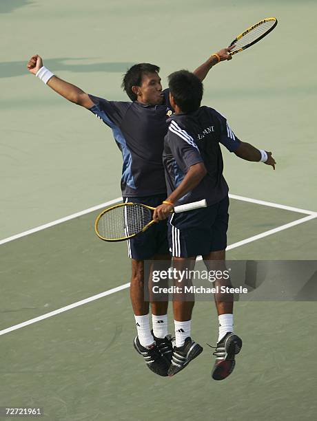 Sonchat and Sanchai Ratiwatana of Thailand celebrate victory against Denis Istomin and Murad Inoyatov of Uzbekistan during the Men's Team...