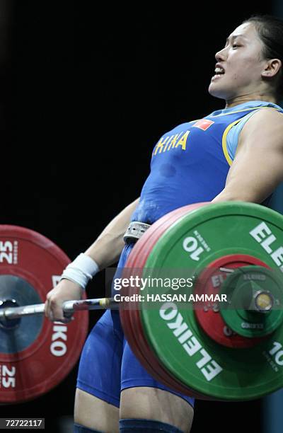 China's world champion Cao Lei competes in the 75kg category in women's weightlifting at the 15th Asian Games in Doha, 05 December 2006. Cao set a...