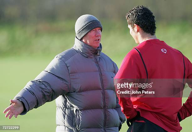 Sir Alex Ferguson and Cristiano Ronaldo of Manchester United in action during a first team training session at Carrington Training Ground on December...
