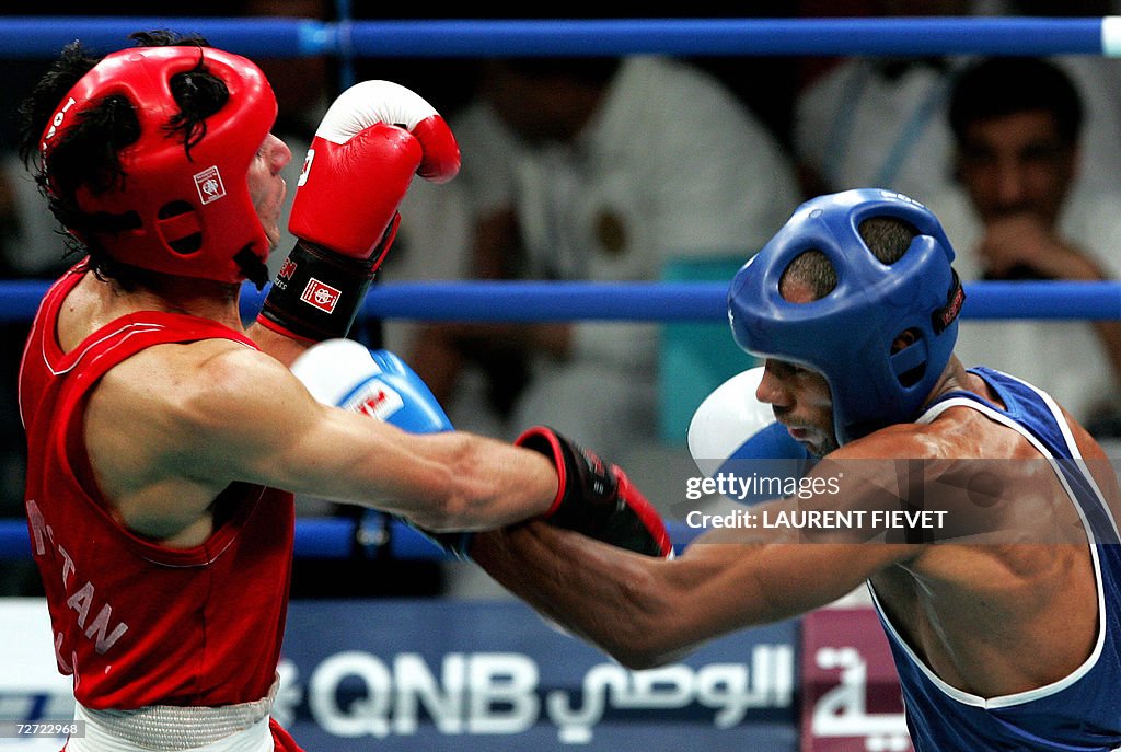 Iraqi Jabar Zuhir (R) throws a punch at