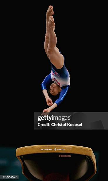 Miki Uemura of Japan competes in the Women's Vault final during the Artistic Gymnastics competition during the 15th Asian Games Doha 2006 at The...