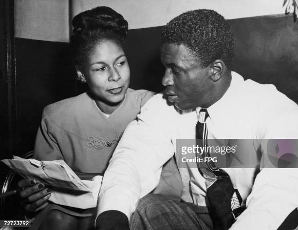 Brooklyn Dodger, and rookie of the year, Jackie Robinson backstage at the Apollo Theater, Harlem, with his wife Rachel, 1947. He is appearing as part...