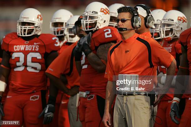 Head coach Mike Gundy of the Oklahoma State Cowboys waits for the results of an official's review in a game against the Oklahoma Sooners on November...