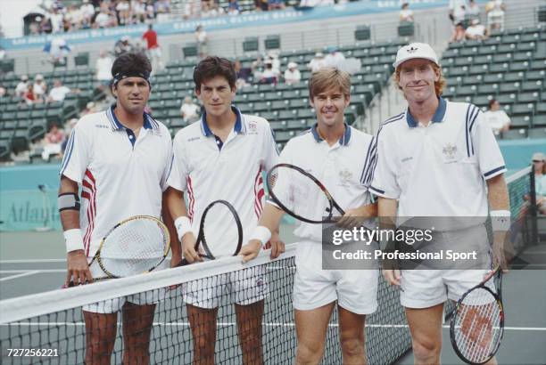 Great Britain tennis players Tim Henman and Neil Broad pictured with Australian tennis players Todd Woodbridge and Mark Woodforde together on court...