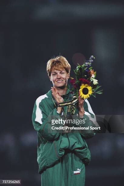 Bulgarian athlete Stefka Kostadinova celebrates on the medal podium after finishing in first place to win the gold medal in the Women's high jump...