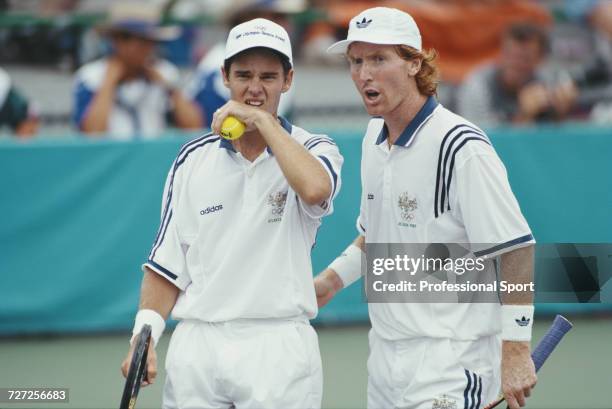 Australian tennis players Todd Woodbridge and Mark Woodforde pictured together during play against Tim Henman and Neil Broad of Great Britain in the...