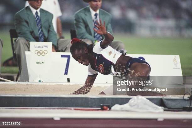 American track and field athlete Jackie Joyner-Kersee competes for the United States team during progress to finish in third place to win the bronze...