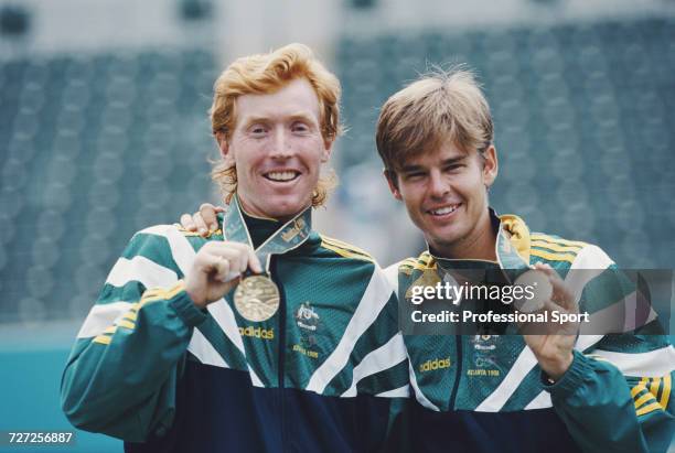 Australian tennis players Mark Woodforde and Todd Woodbridge pictured together on the medal podium after finishing in first place to win the gold...