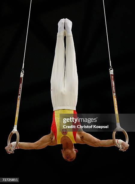 Chen Yibing of China competes in the Men's rings final during the Artistic Gymnastics competition during the 15th Asian Games Doha 2006 at The Aspire...