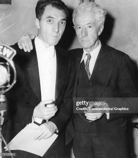 Ford Frick, left, talks with baseball commissioner Kennesaw Mountain Landis after Frick was named president of the National League at a meeting of...