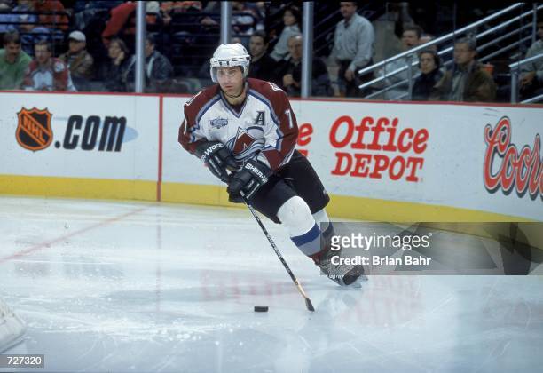 Ray Bourque of the Colorado Avalanche skates with the puck during the game against the Dallas Stars at the Pepsi Center in Denver, Colorado. The...