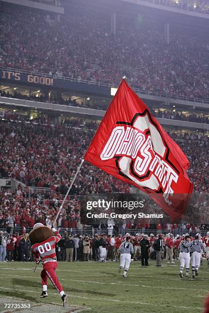 Ohio State Buckeyes mascot Brutus Buckeye waves a giant flag during the game against the Michigan Wolverines on November 18, 2006 at Ohio Stadium in...