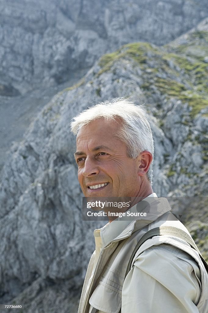 Senior man and mountains