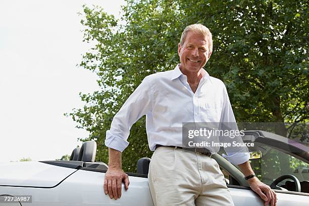 senior man leaning on convertible - only senior men 個照片及圖片檔