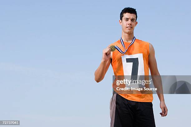 winning athlete - marathon medal stock pictures, royalty-free photos & images