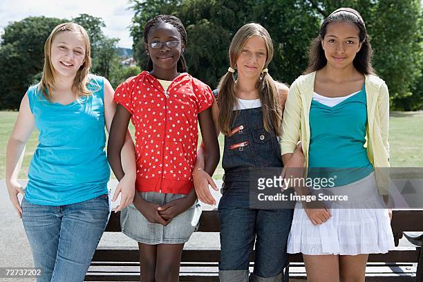 teenage friends - arm in arm stock pictures, royalty-free photos & images