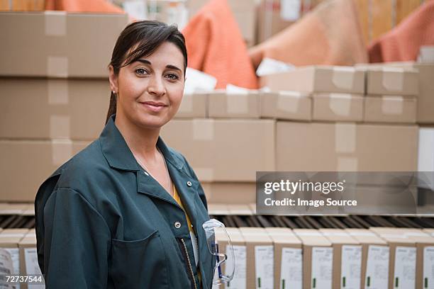 woman working in a distribution warehouse - manufacturing occupation stock pictures, royalty-free photos & images