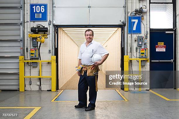 man standing in a loading bay - loading docks stock pictures, royalty-free photos & images